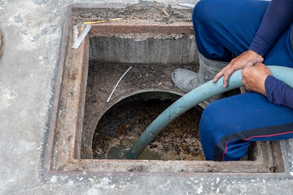 grease trap pumping involves removing the accumulated grease and food waste from the trap using specialized equipment